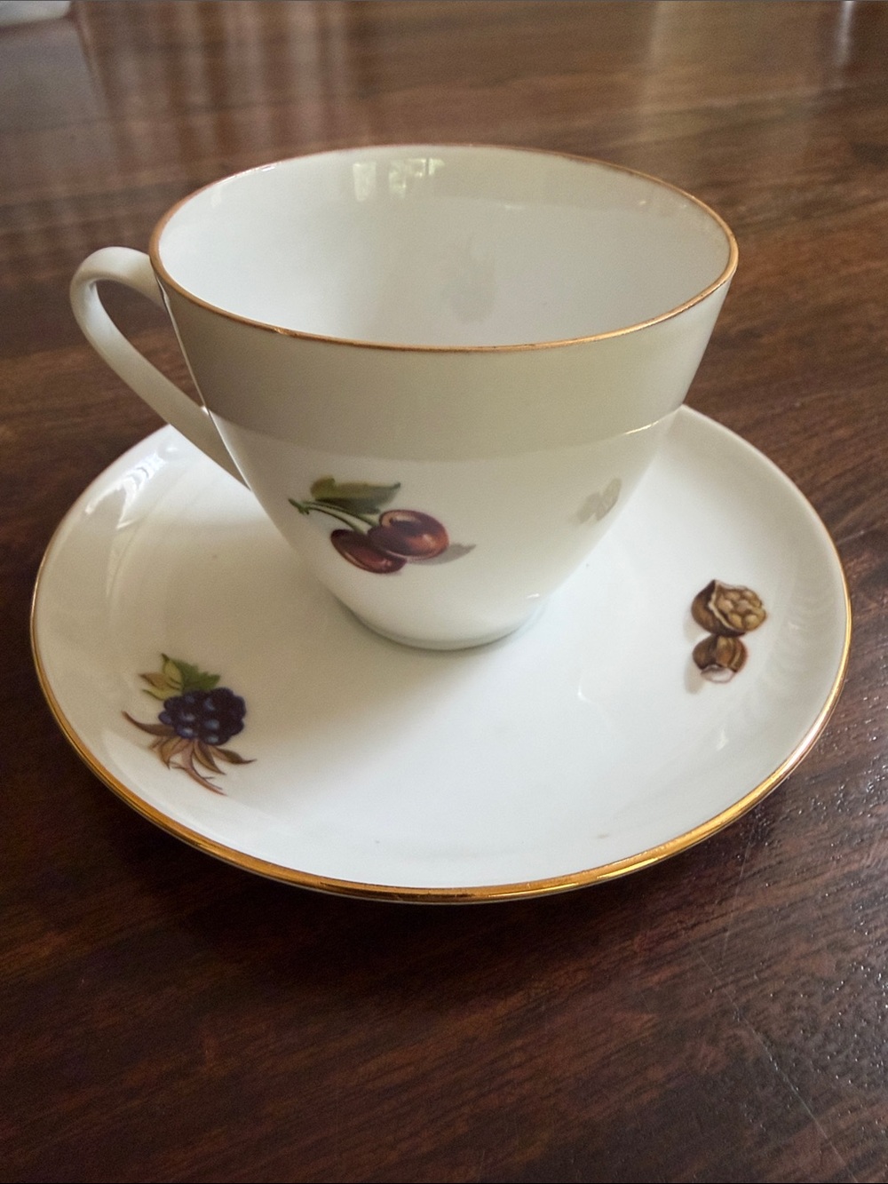 Elegant White Bone China Teacup and Saucer with Gold Trim - Fruit Motif